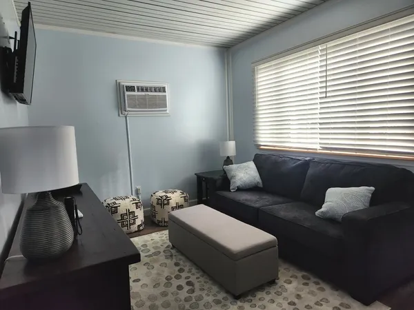 a bathroom with a sink a mirror and a shower