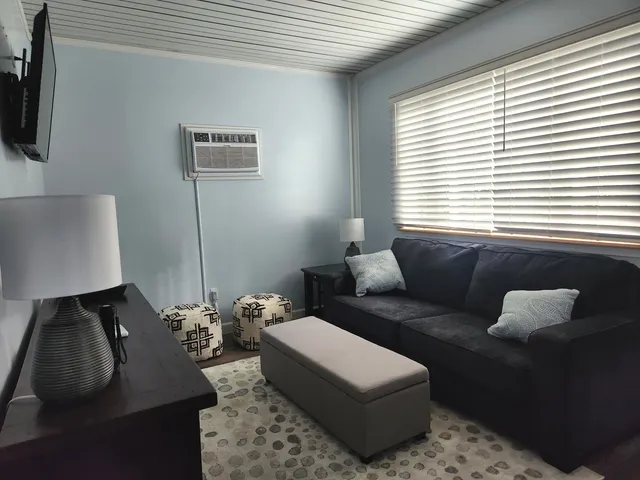 a bathroom with a sink a mirror and a shower