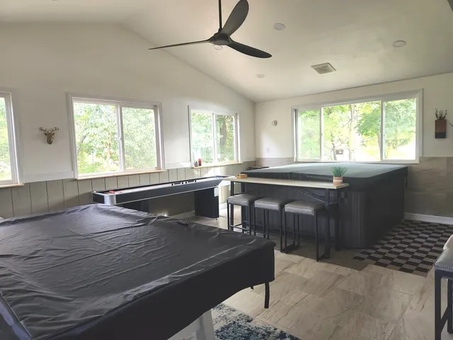 a bedroom with a bed and a potted plant