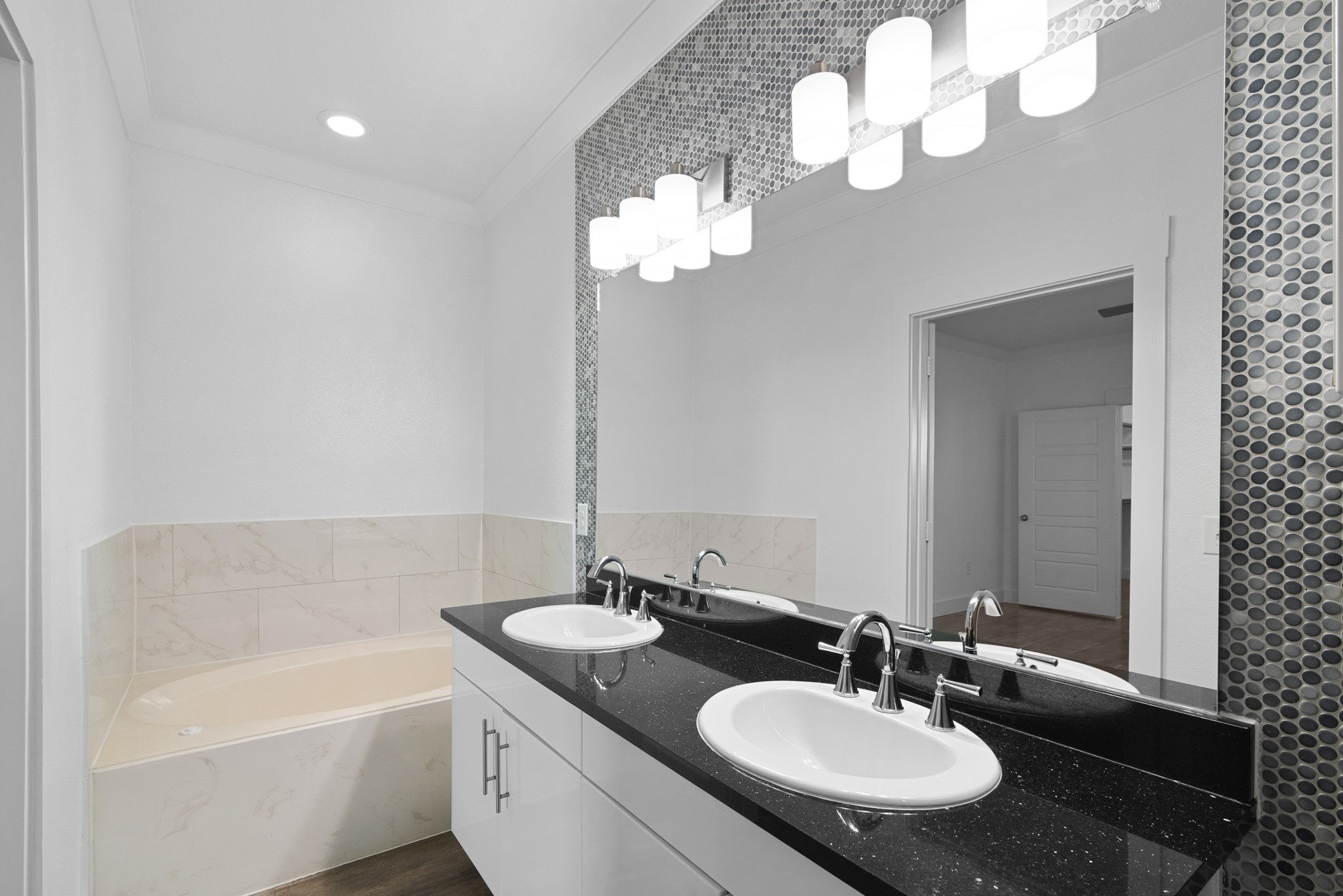 366 Fm 1488 Road, Unit 1042 Conroe, TX 77384 - Photo 18 of 38 a bathroom with a double vanity sink and a mirror