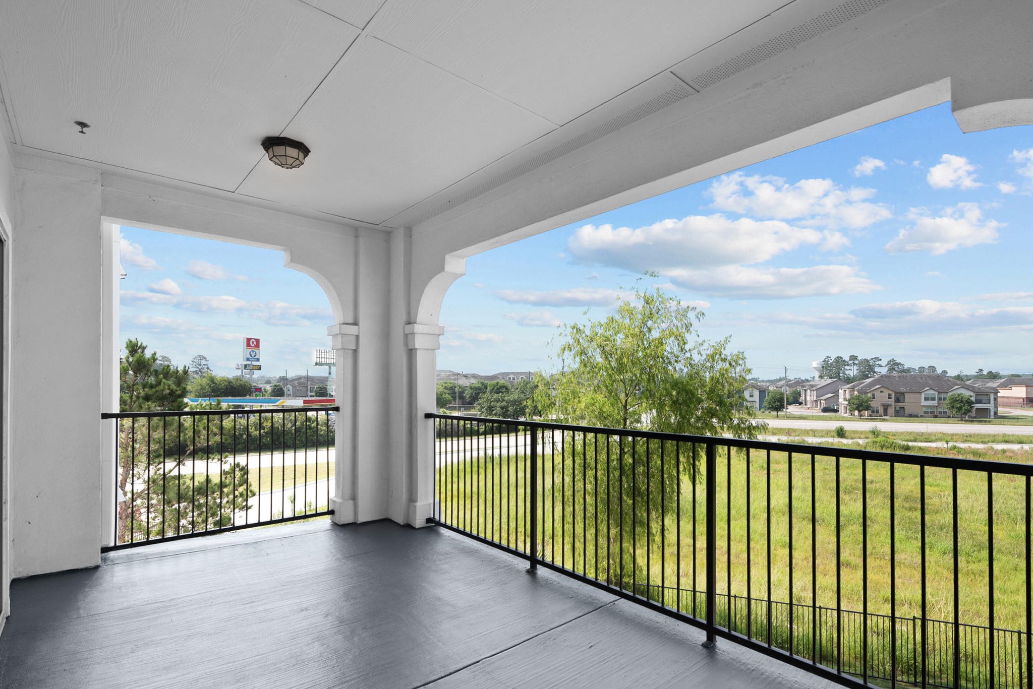 366 Fm 1488 Road, Unit 1042 Conroe, TX 77384 - Photo 21 of 38 a view of a city from a balcony
