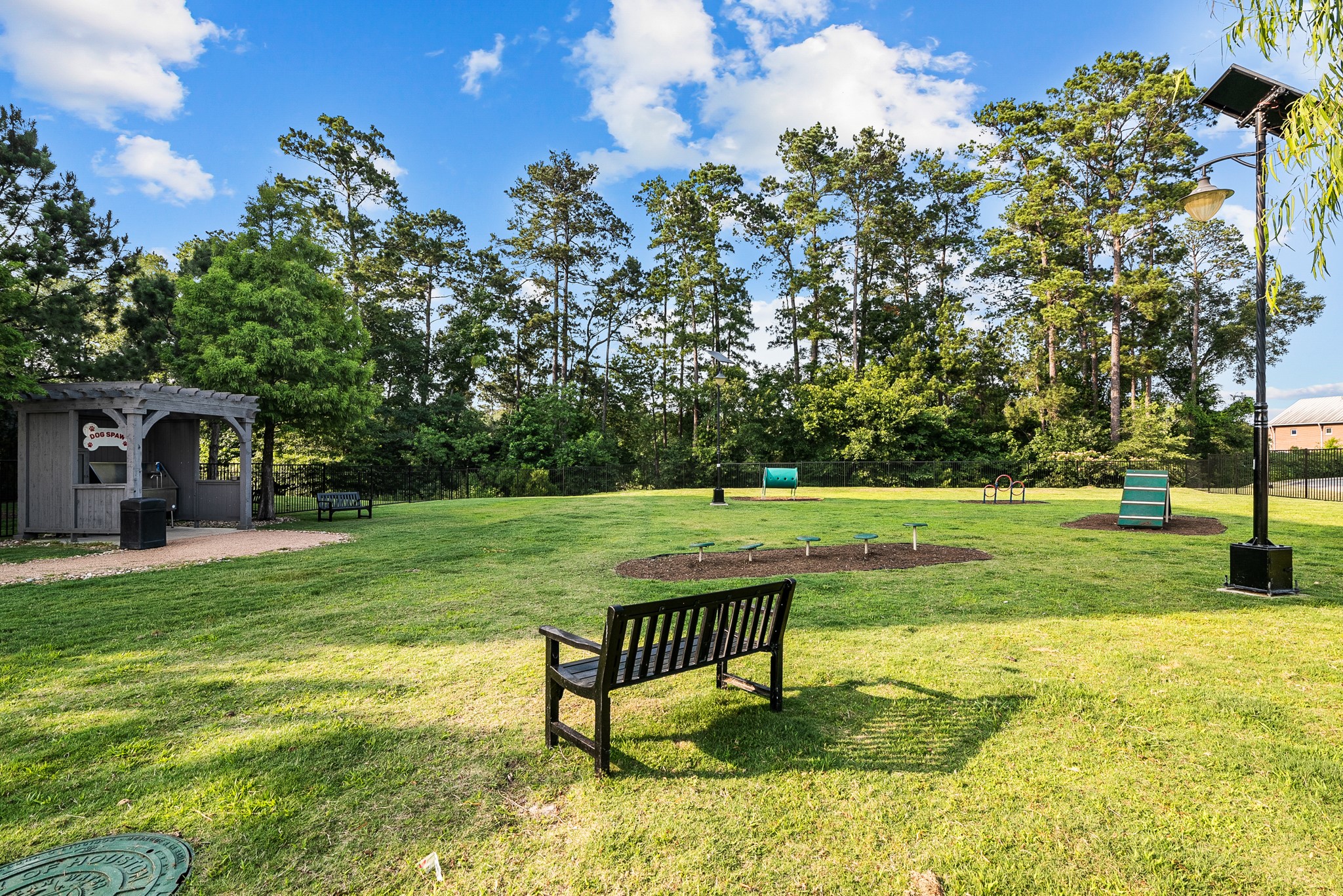 366 Fm 1488 Road, Unit 1042 Conroe, TX 77384 - Photo 35 of 38 a view of a park with large trees