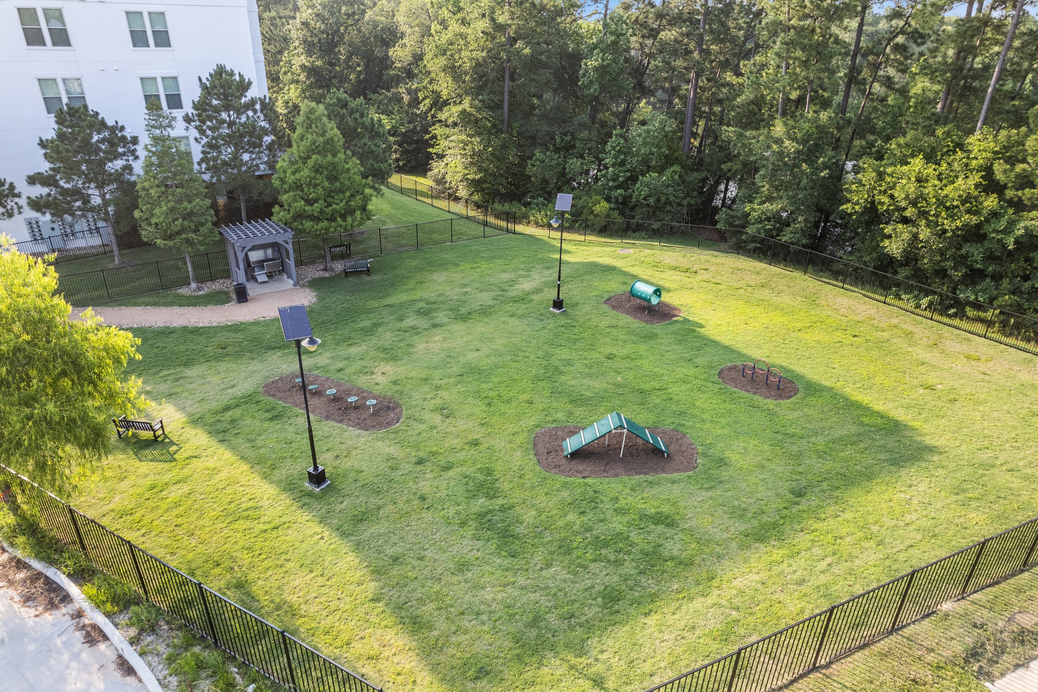 366 Fm 1488 Road, Unit 1042 Conroe, TX 77384 - Photo 36 of 38 a view of a garden with a swimming pool