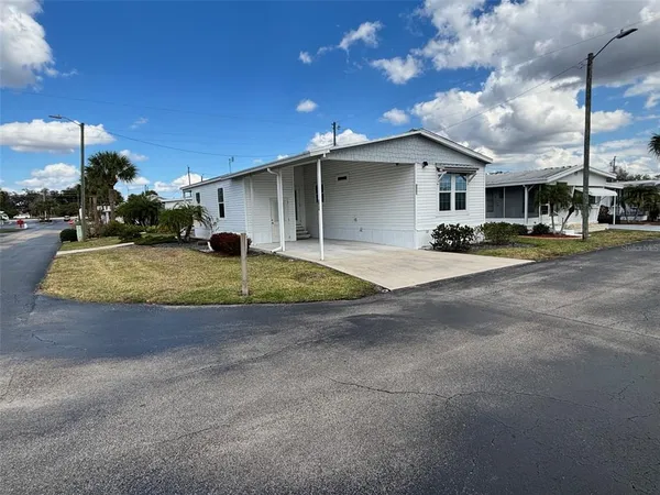 a view of a house with a yard and garage