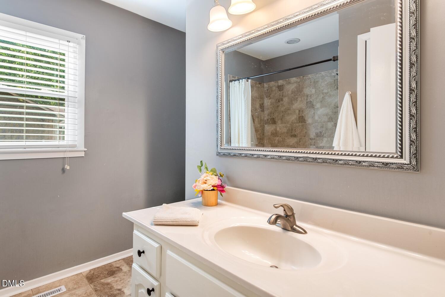 134 Longview Road Madison, NC 27025 - Photo 39 of 49 a bathroom with a sink and a mirror