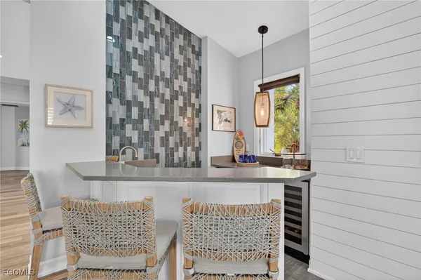 a view of a kitchen with a table and chairs