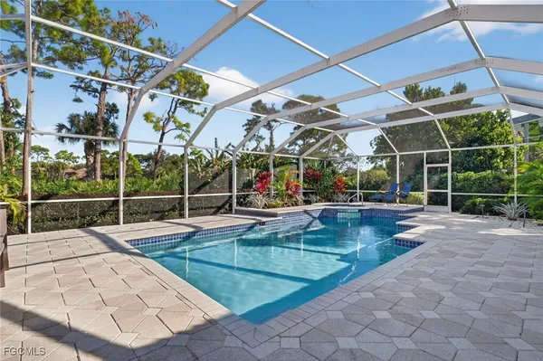 a view of a swimming pool with a patio