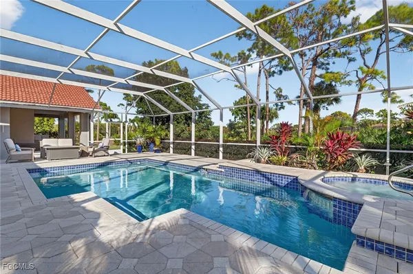 a view of a backyard with sitting area