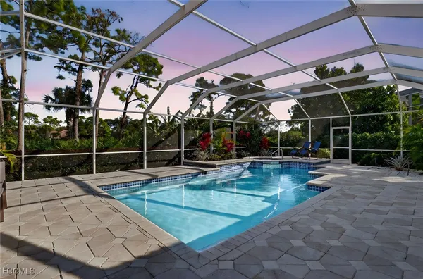 a view of a swimming pool with a patio