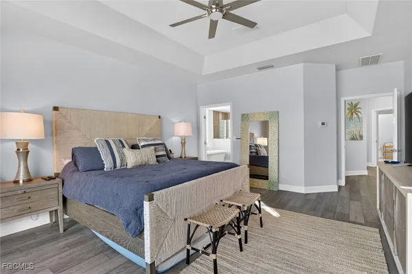 a bedroom with a bed and a table