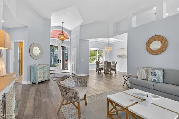 a living room with furniture and a clock