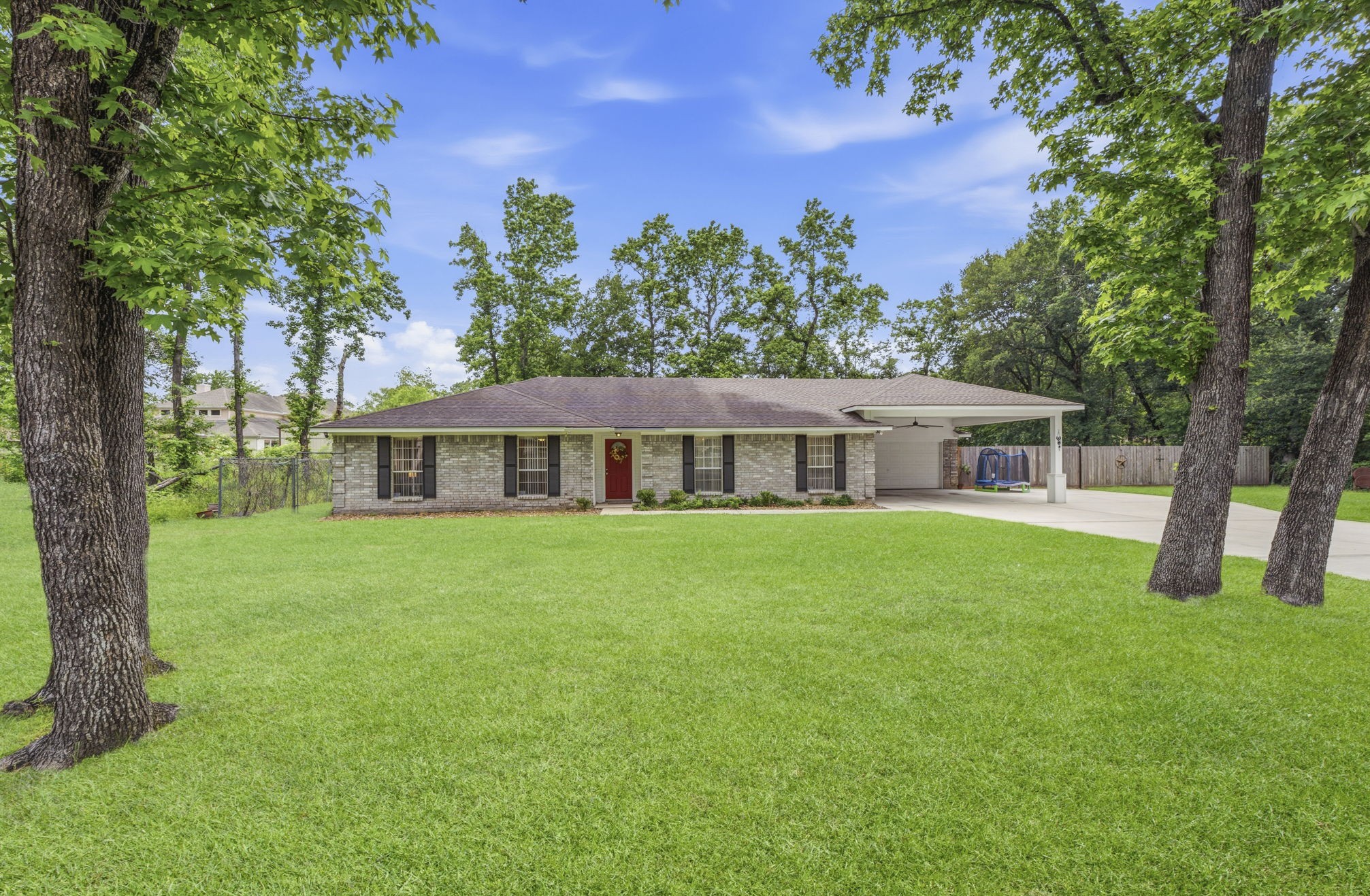 21809 Tophill Drive Spring, TX 77388 - Photo 1 of 50 a view of a house with a yard