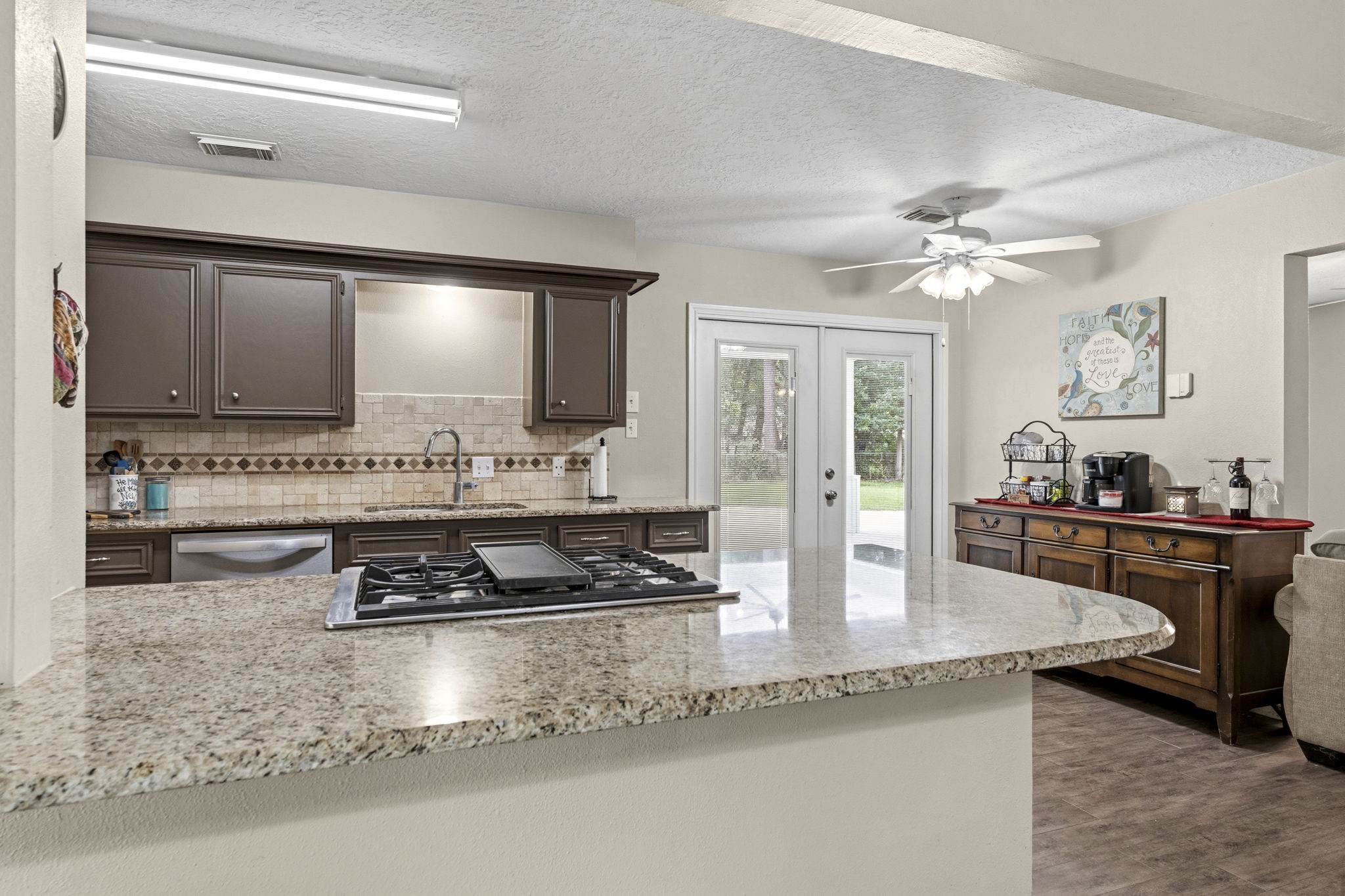 21809 Tophill Drive Spring, TX 77388 - Photo 13 of 50 a kitchen with stainless steel appliances granite countertop a sink stove and cabinets