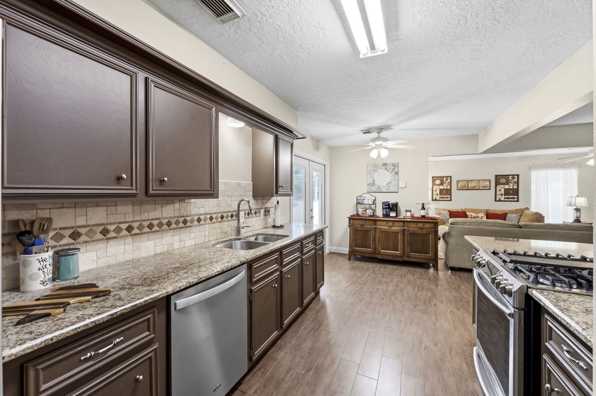 21809 Tophill Drive Spring, TX 77388 - Photo 15 of 50 a kitchen with stainless steel appliances a sink dishwasher stove and oven
