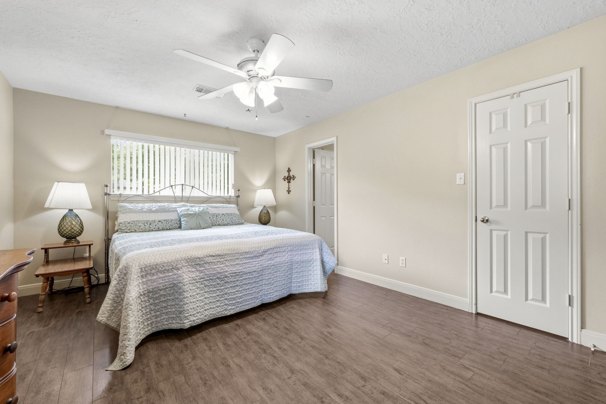 21809 Tophill Drive Spring, TX 77388 - Photo 18 of 50 a bedroom with a bed and wooden floor
