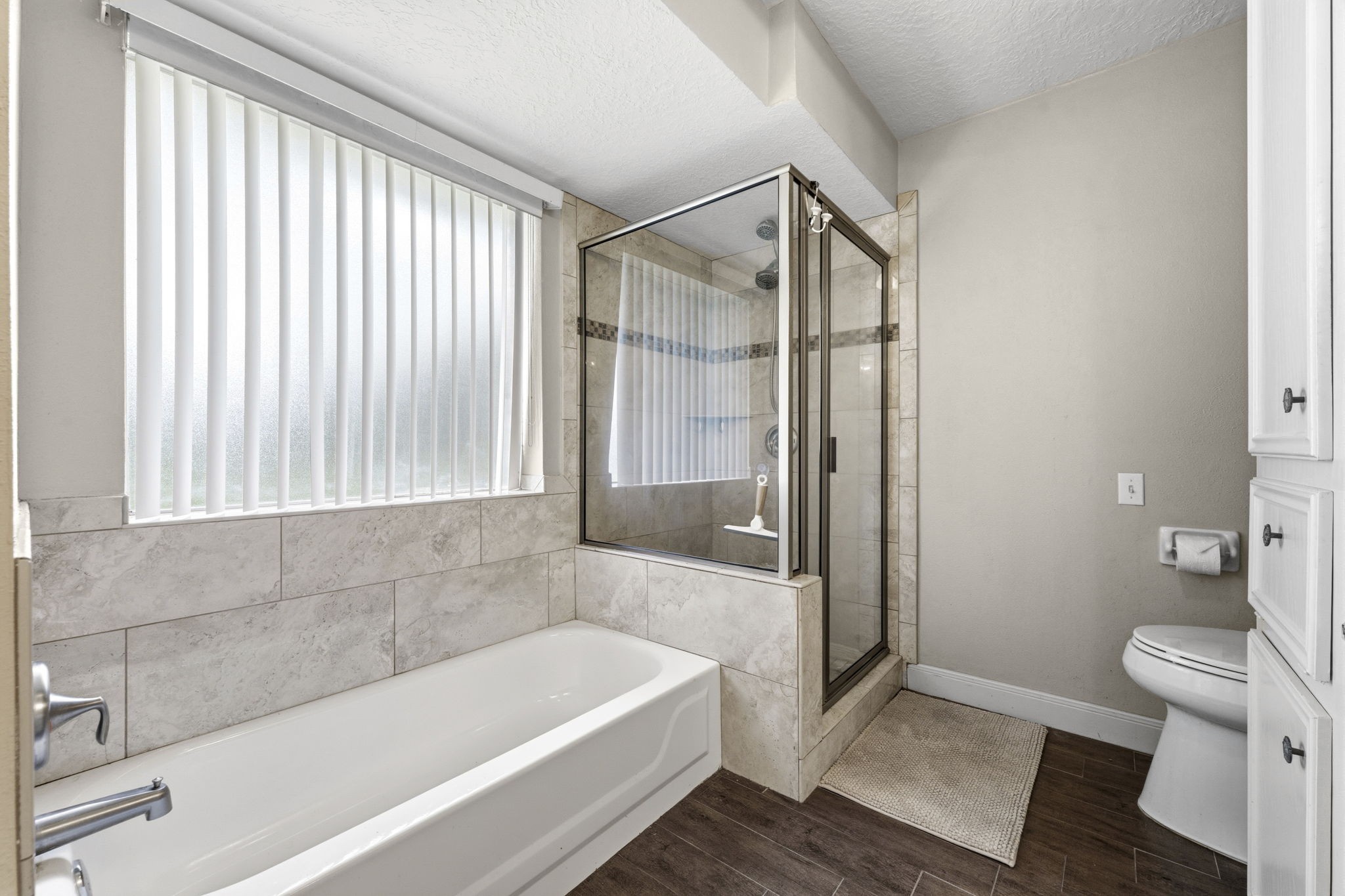 21809 Tophill Drive Spring, TX 77388 - Photo 20 of 50 a bathroom with a bathtub and a toilet