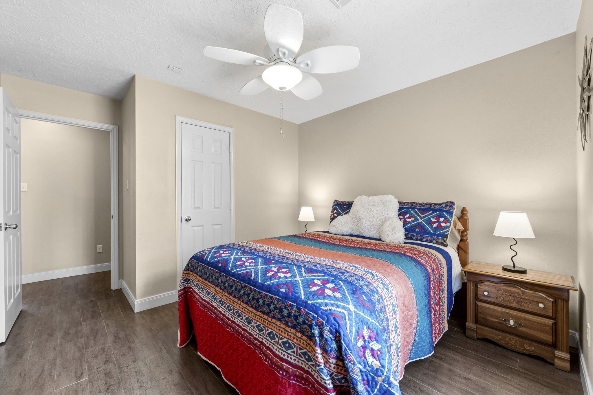 21809 Tophill Drive Spring, TX 77388 - Photo 23 of 50 a bedroom with a bed and a chandelier