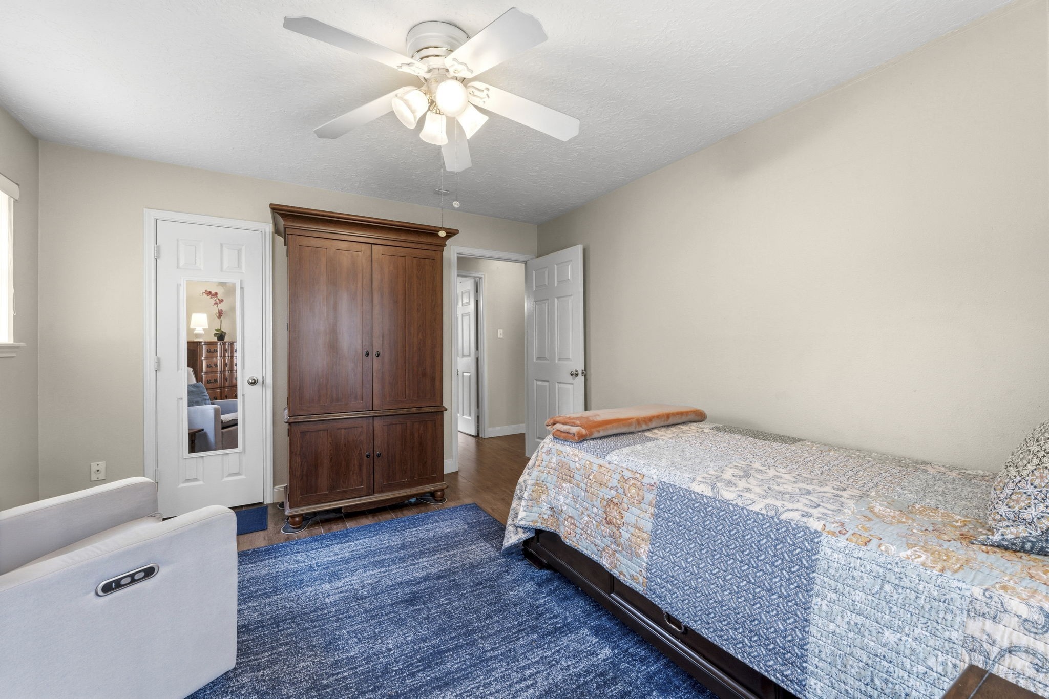 21809 Tophill Drive Spring, TX 77388 - Photo 25 of 50 a bedroom with a bed and a chandelier