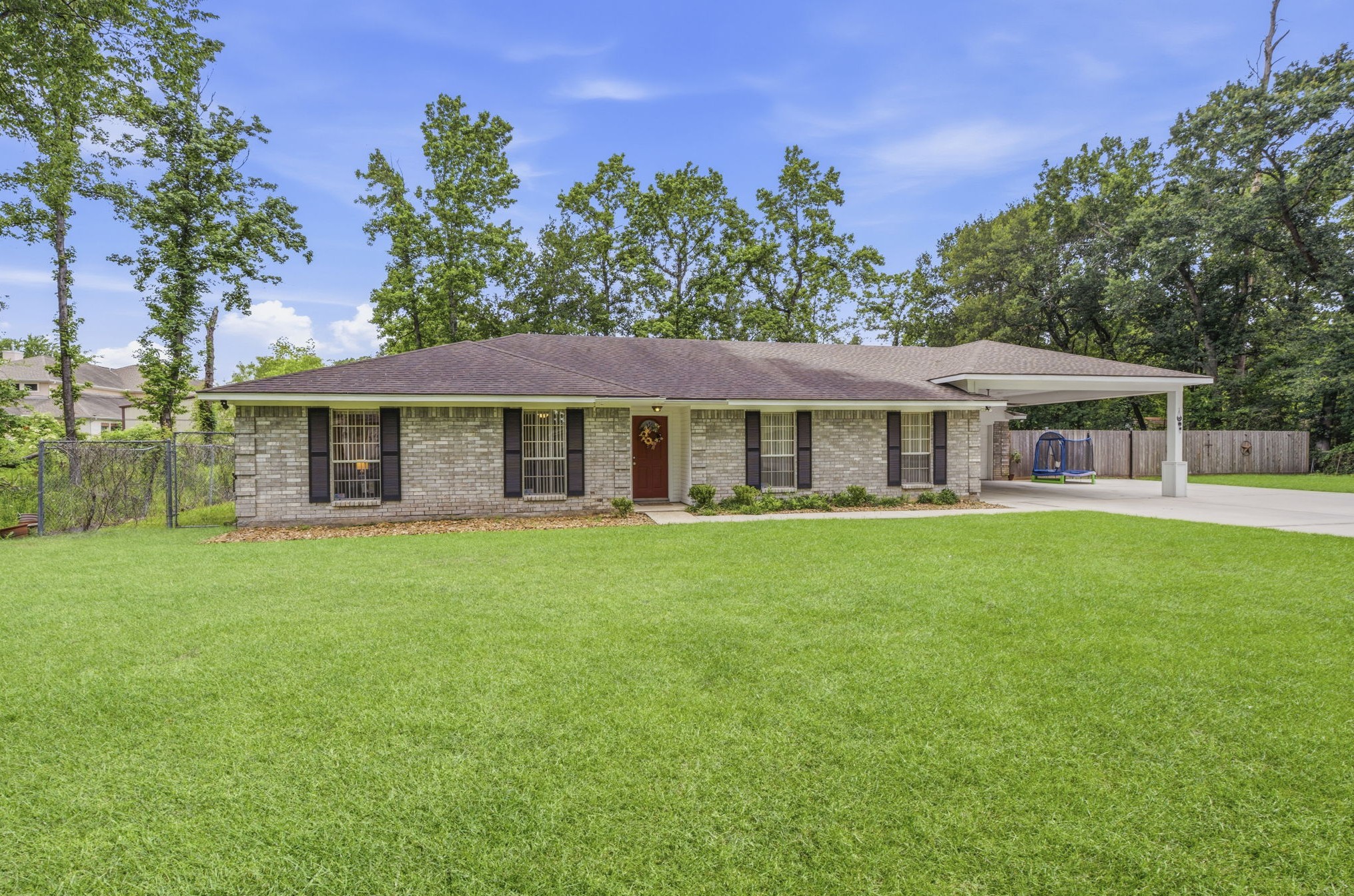 21809 Tophill Drive Spring, TX 77388 - Photo 48 of 50 a front view of a house with a garden