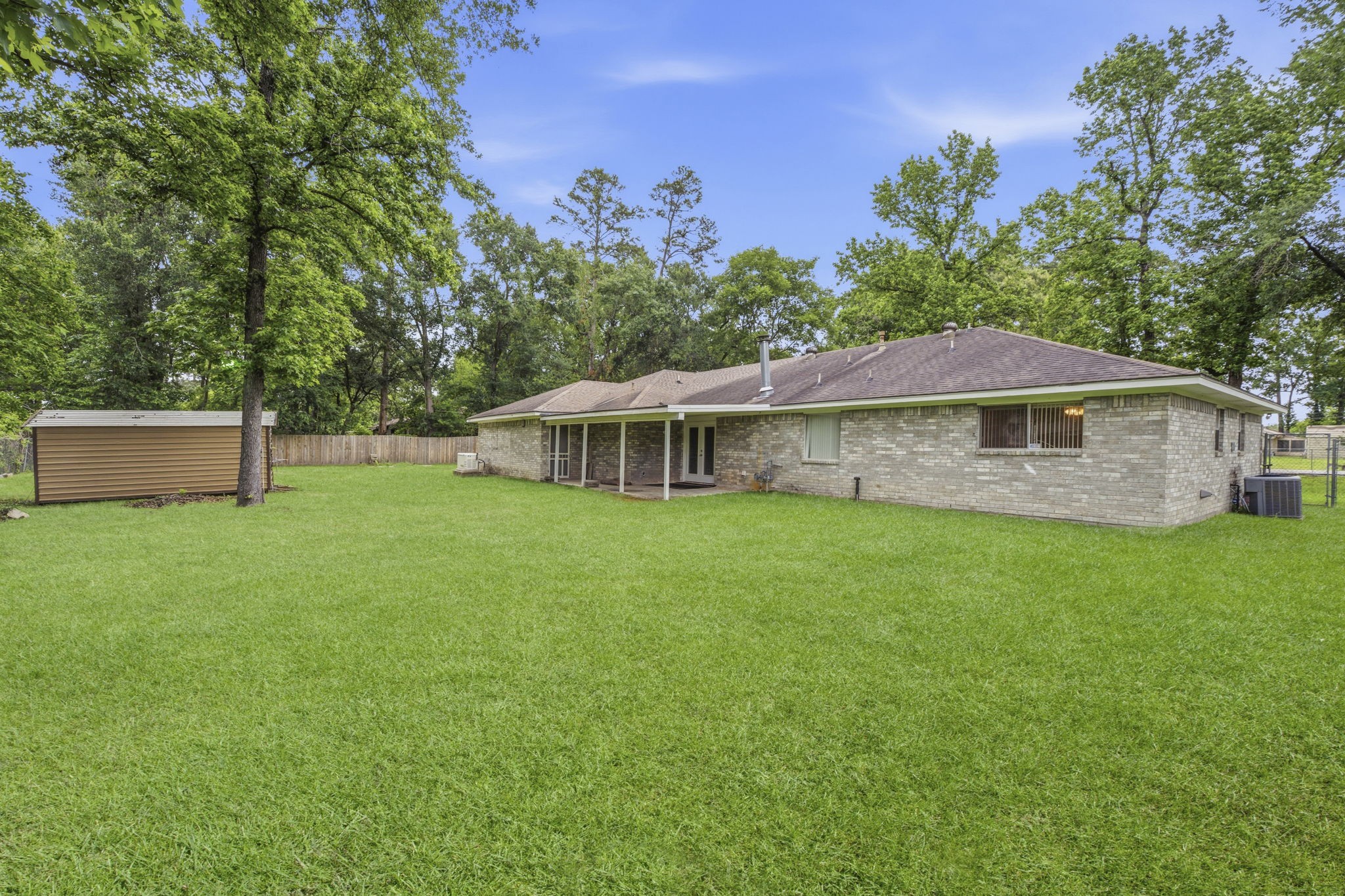 21809 Tophill Drive Spring, TX 77388 - Photo 39 of 50 a view of a house with a yard and sitting area