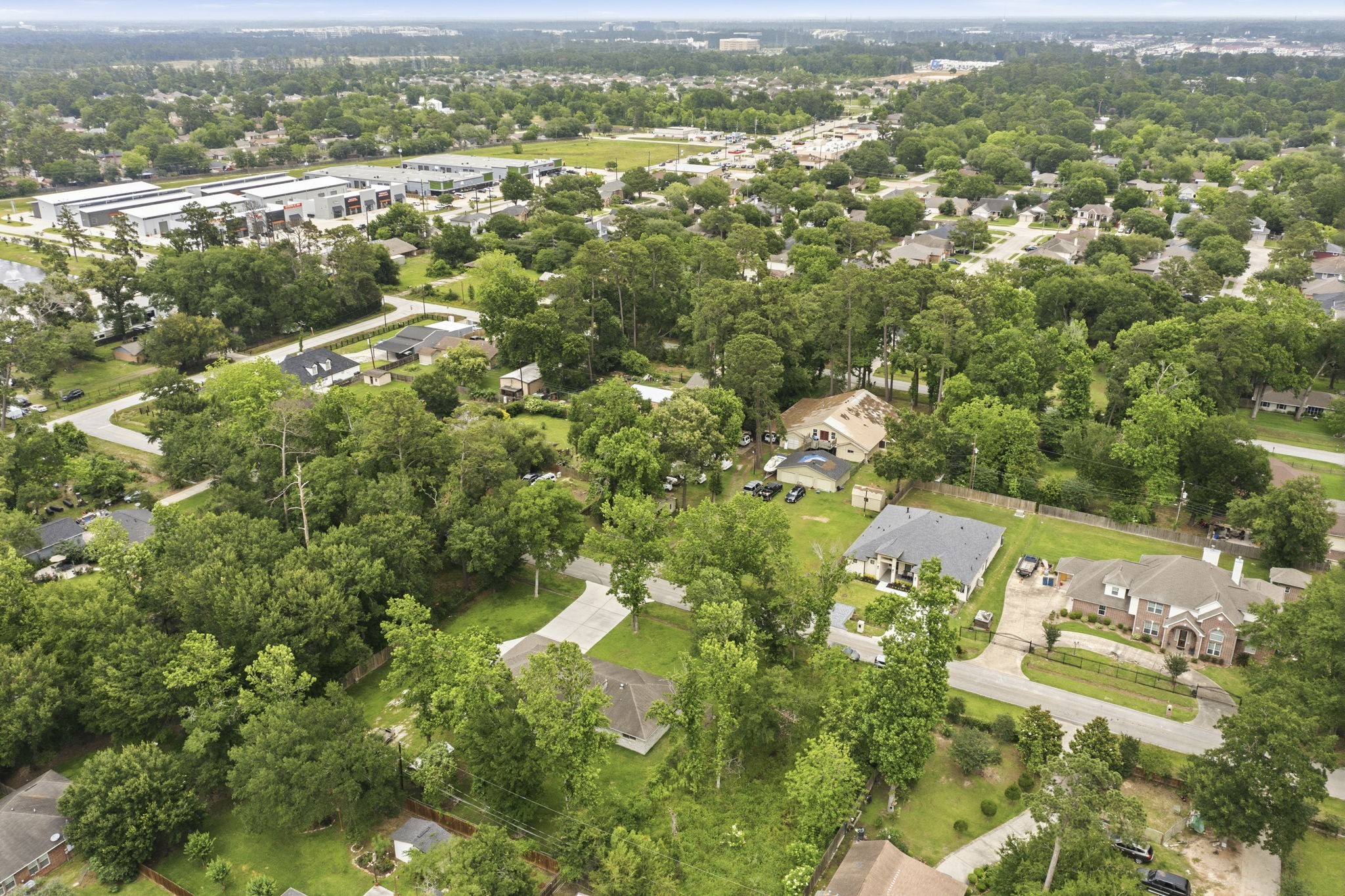 21809 Tophill Drive Spring, TX 77388 - Photo 42 of 50 an aerial view of residential houses with outdoor space and trees
