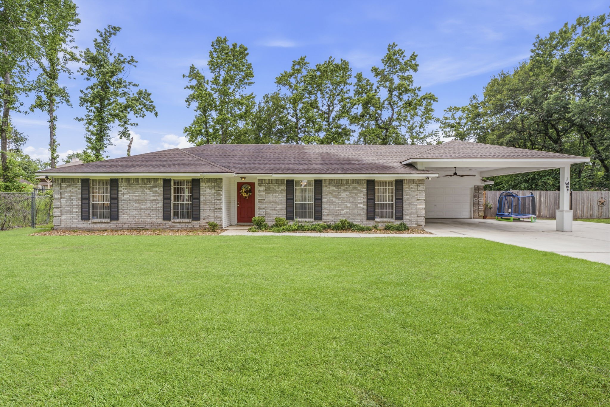 21809 Tophill Drive Spring, TX 77388 - Photo 47 of 50 a front view of a house with a garden