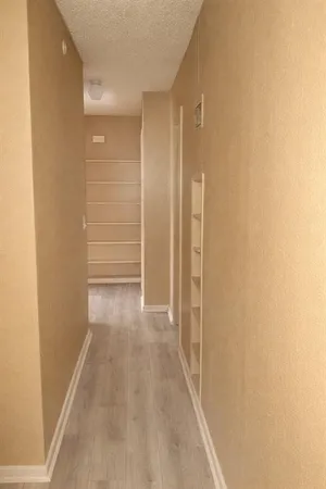 a utility room with cabinets washer and dryer