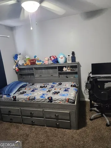 a bed room with a bed and a fish tank