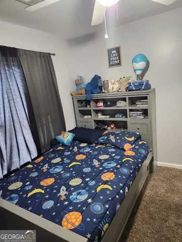 a bed room with a bed and a fish tank