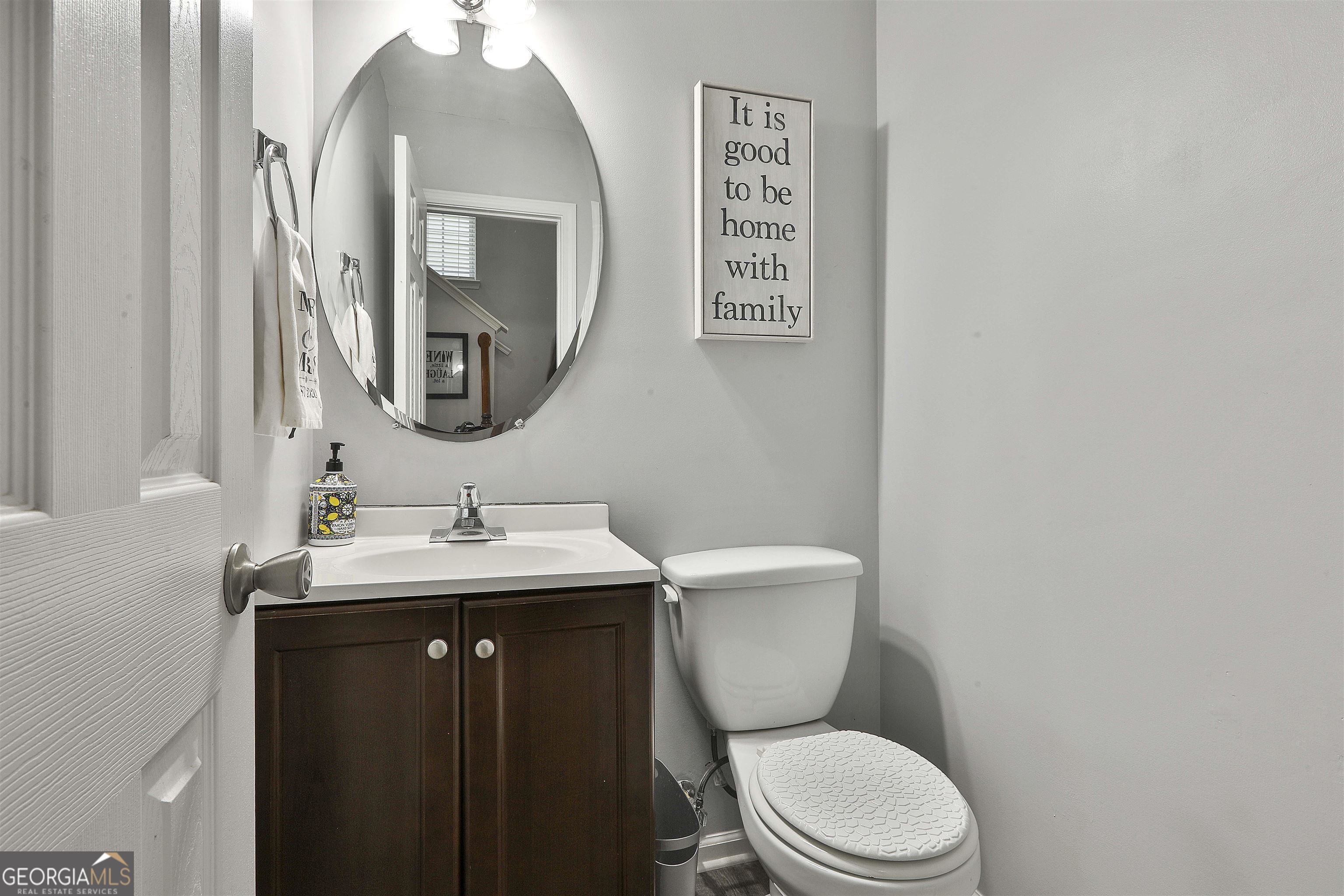 49 Preserve Drive Newnan, GA 30263 - Photo 17 of 17 a bathroom with a toilet a sink and mirror