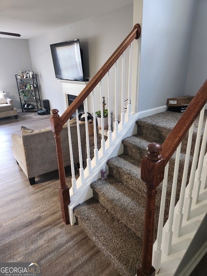 49 Preserve Drive Newnan, GA 30263 - Photo 6 of 17 a view of staircase with wooden floor and windows