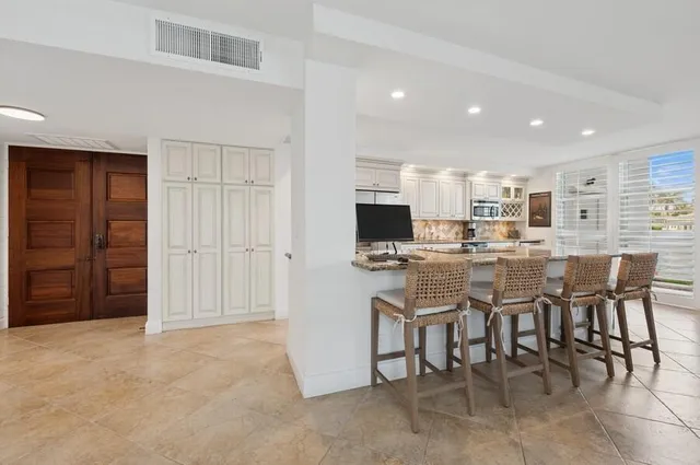 a view of a dining room kitchen and a window