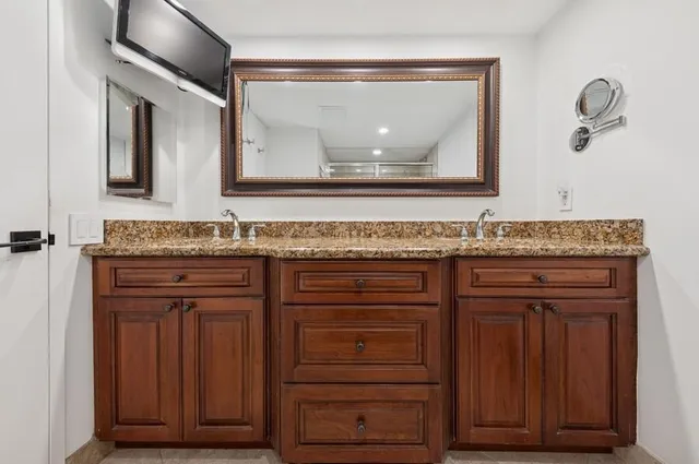 a bathroom that has a toilet and a shower