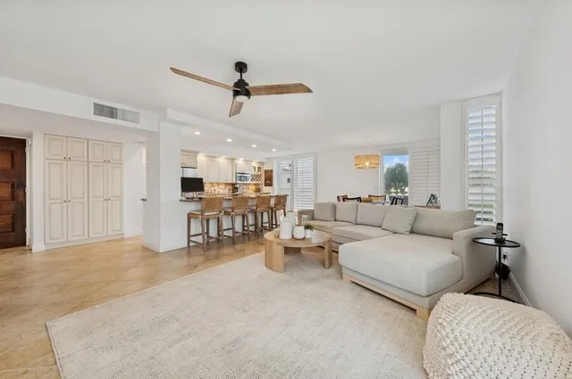 a living room with furniture and a table