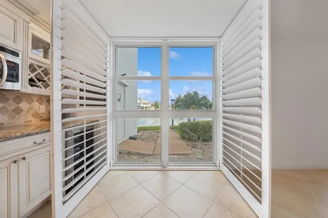 a view of a hallway with windows