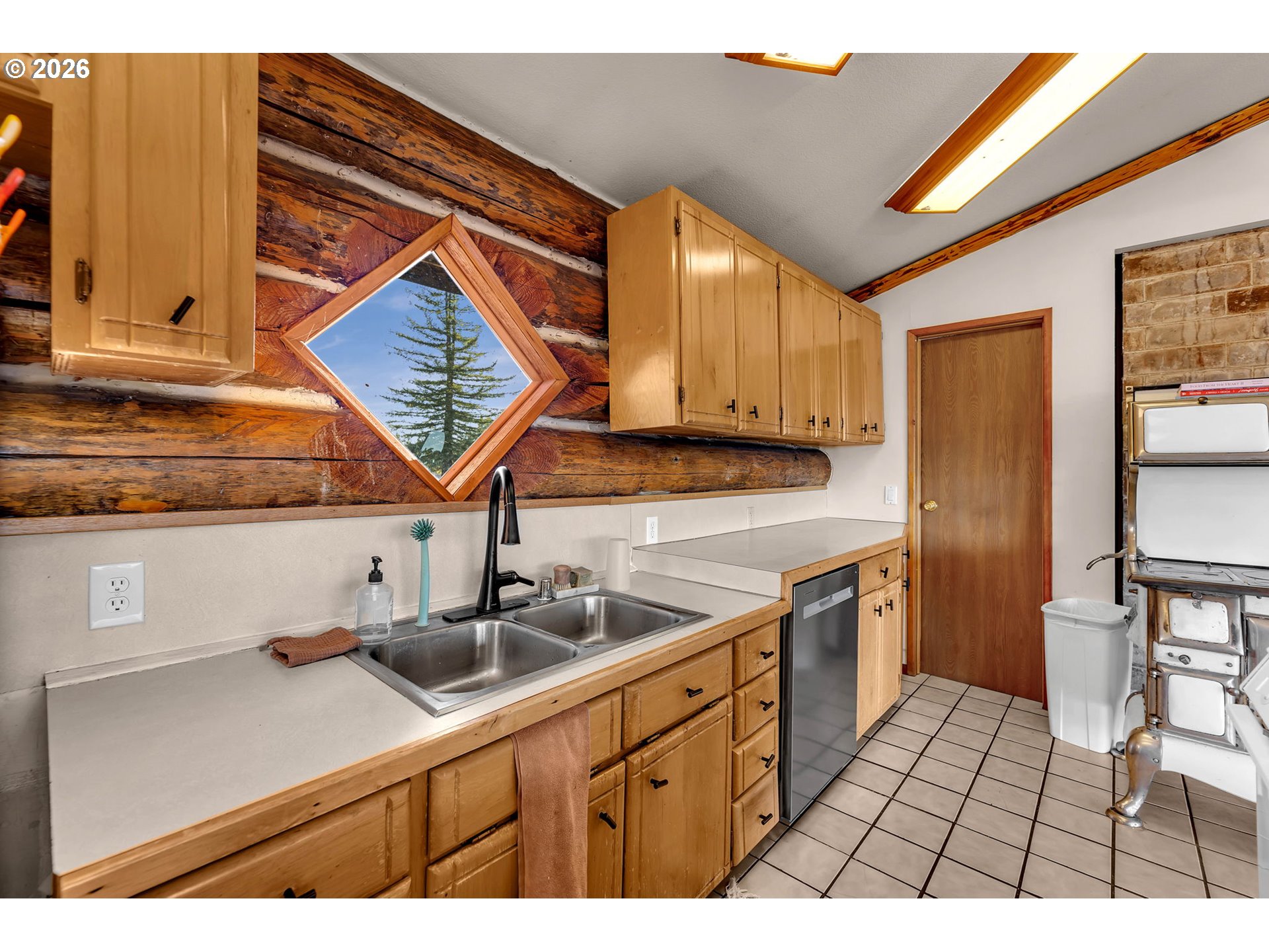 39904 Northeast Rotschy Road Yacolt, WA 98675 - Photo 18 of 48 a kitchen with a sink cabinets and appliances