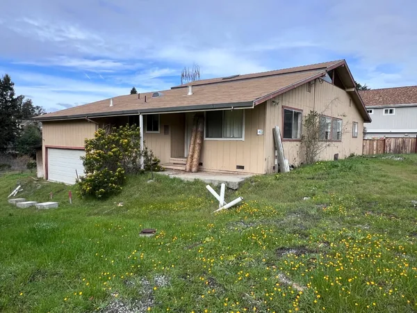 a house view with a garden space