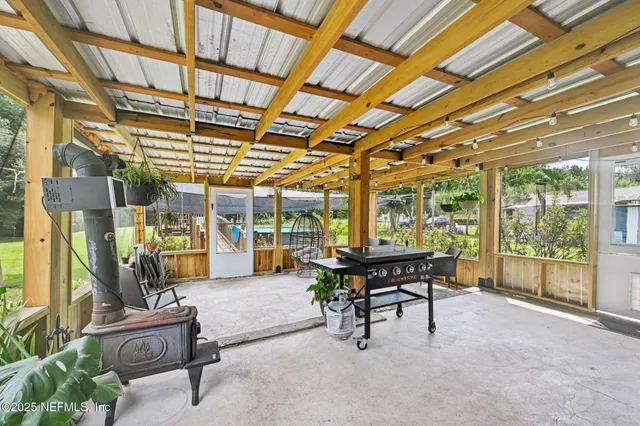 a building outdoor space with patio furniture and potted plants
