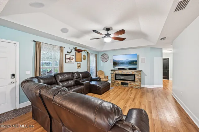 a living room with furniture and a flat screen tv
