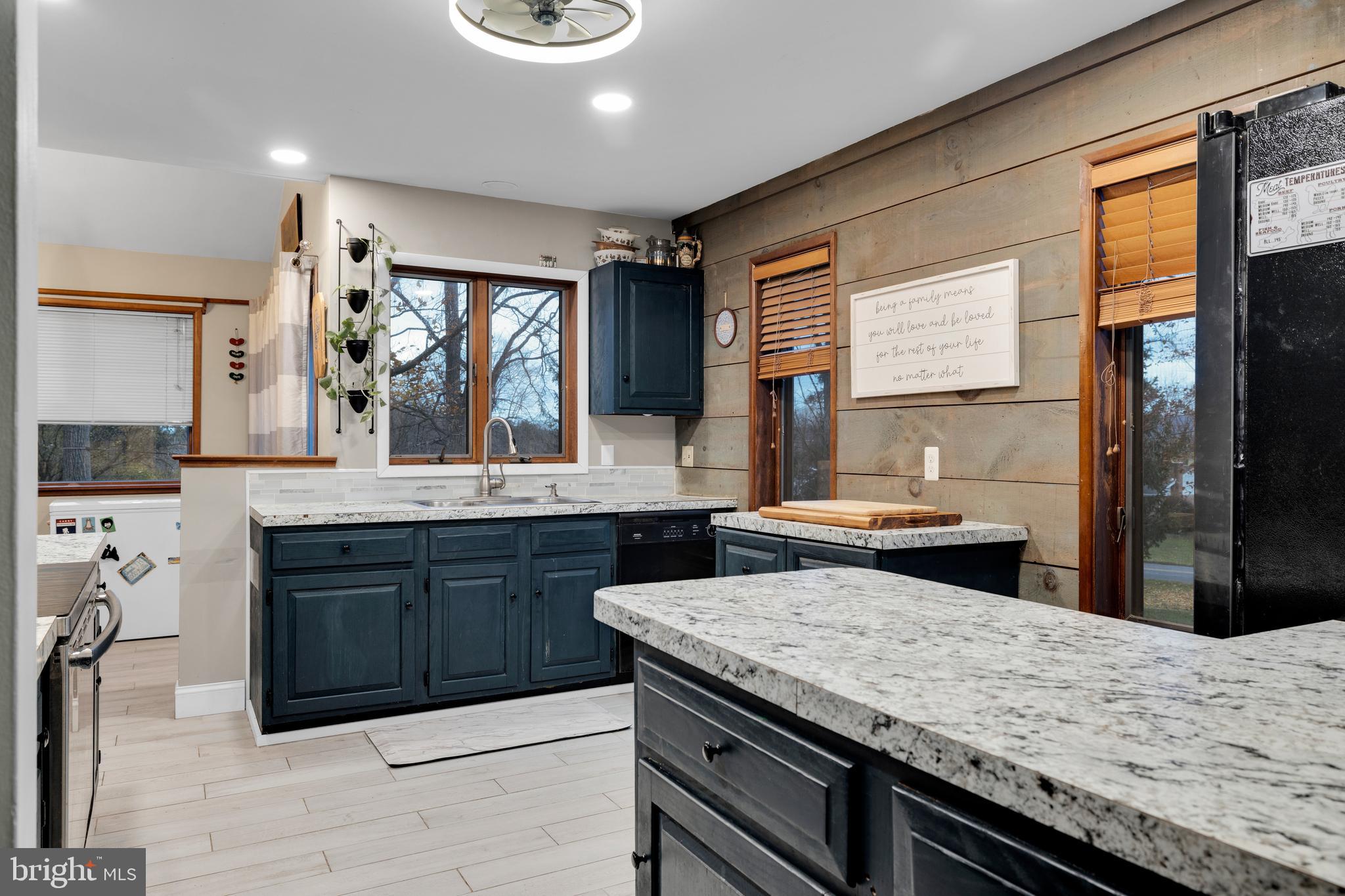 111 Kohler Road Kutztown, PA 19530 - Photo 9 of 19 a kitchen with a stove and a wooden floor