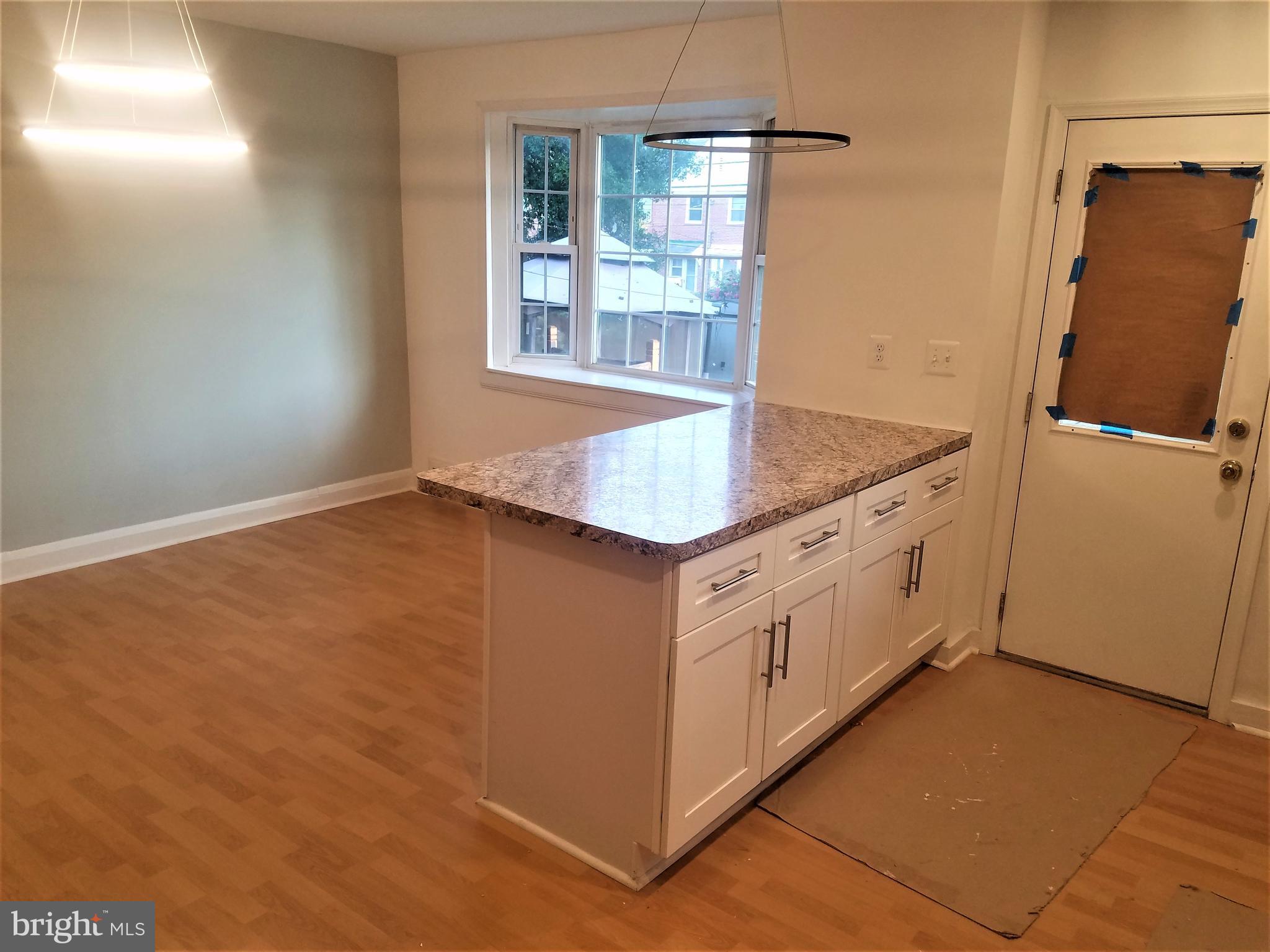 1529 Stonewood Road Baltimore, MD 21239 - Photo 5 of 21 Open Concept kitchen-dining rooms with island