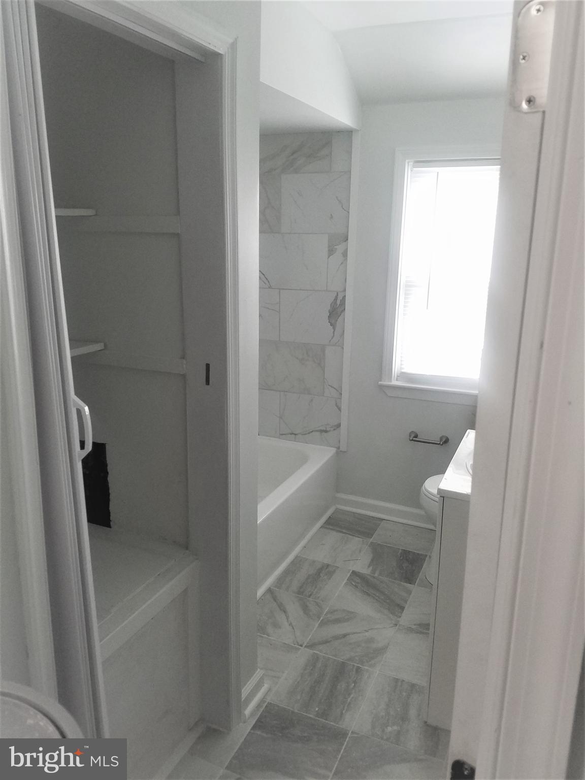 1529 Stonewood Road Baltimore, MD 21239 - Photo 9 of 21 Fully renovated main bathroom