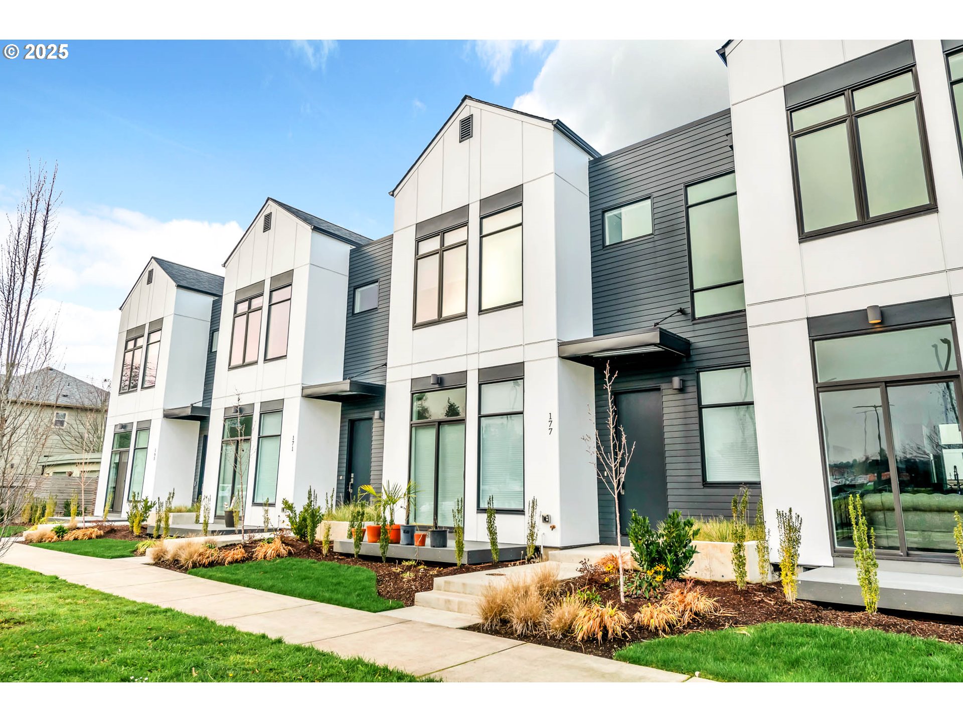 177 East 20th Avenue Eugene, OR 97405 - Photo 1 of 45 a front view of a residential apartment building with a yard