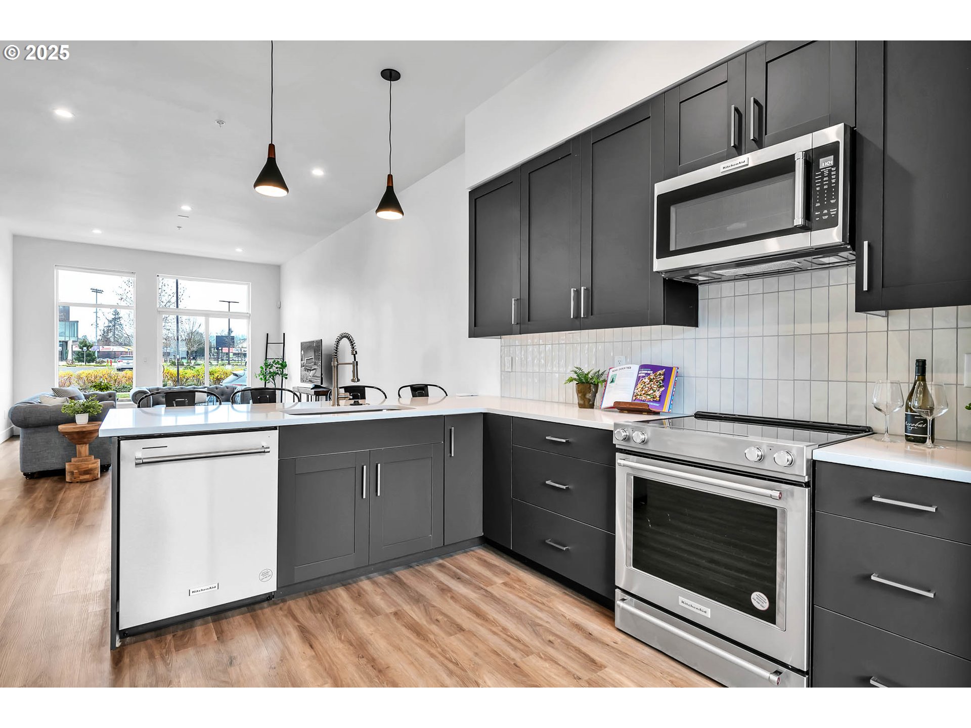 177 East 20th Avenue Eugene, OR 97405 - Photo 17 of 45 a kitchen with granite countertop wooden cabinets stainless steel appliances and a sink