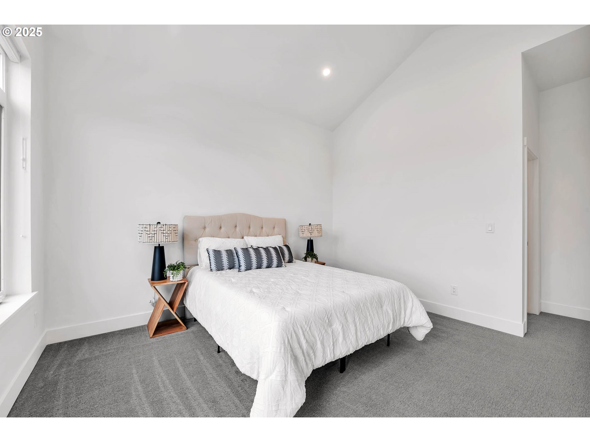 177 East 20th Avenue Eugene, OR 97405 - Photo 24 of 45 a bedroom with a bed and wooden floor