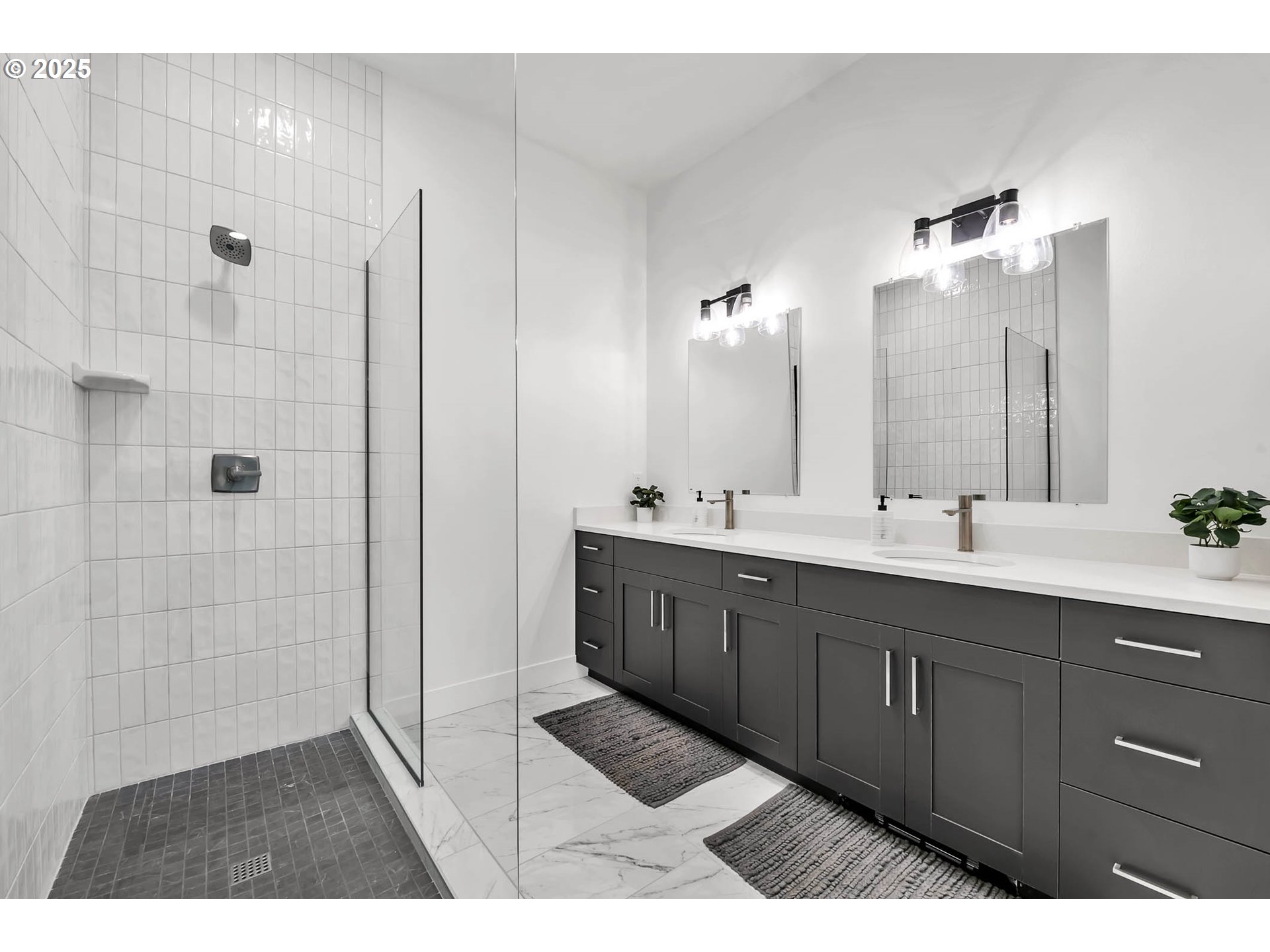 177 East 20th Avenue Eugene, OR 97405 - Photo 25 of 45 a bathroom with a double vanity sink a mirror and a shower