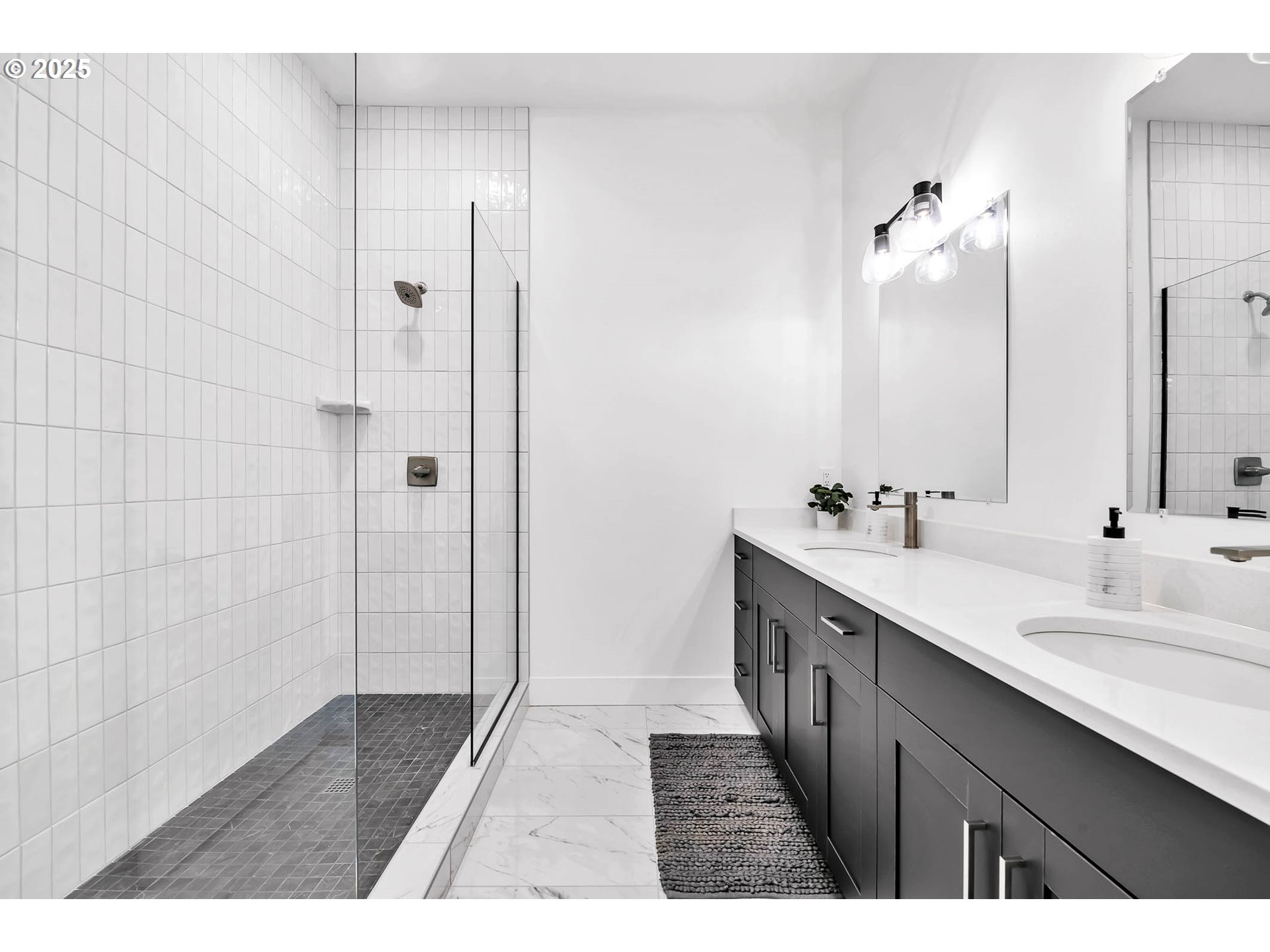 177 East 20th Avenue Eugene, OR 97405 - Photo 26 of 45 a bathroom with a double vanity sink and mirror