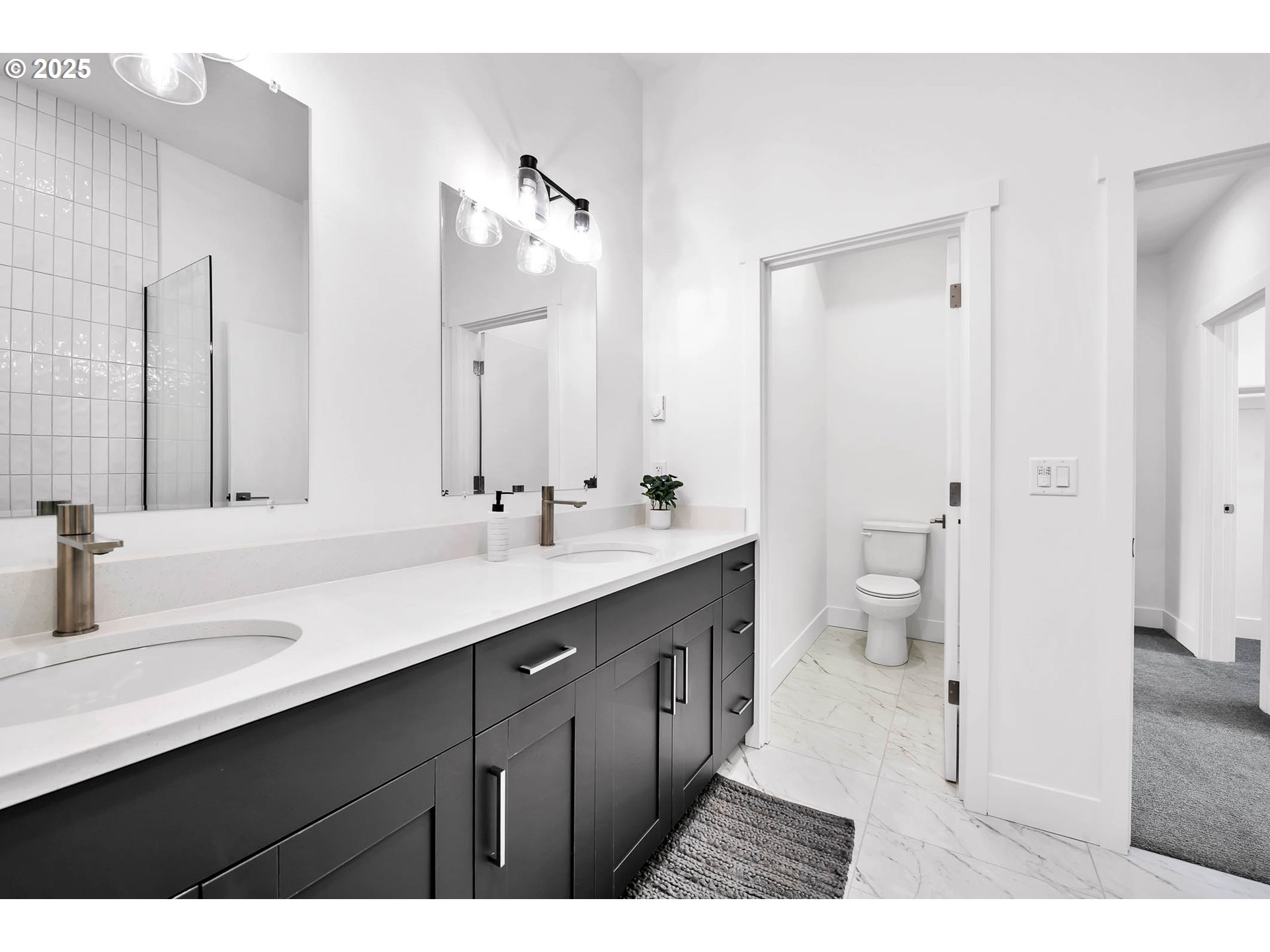 177 East 20th Avenue Eugene, OR 97405 - Photo 28 of 45 a bathroom with a sink double vanity shower and a mirror