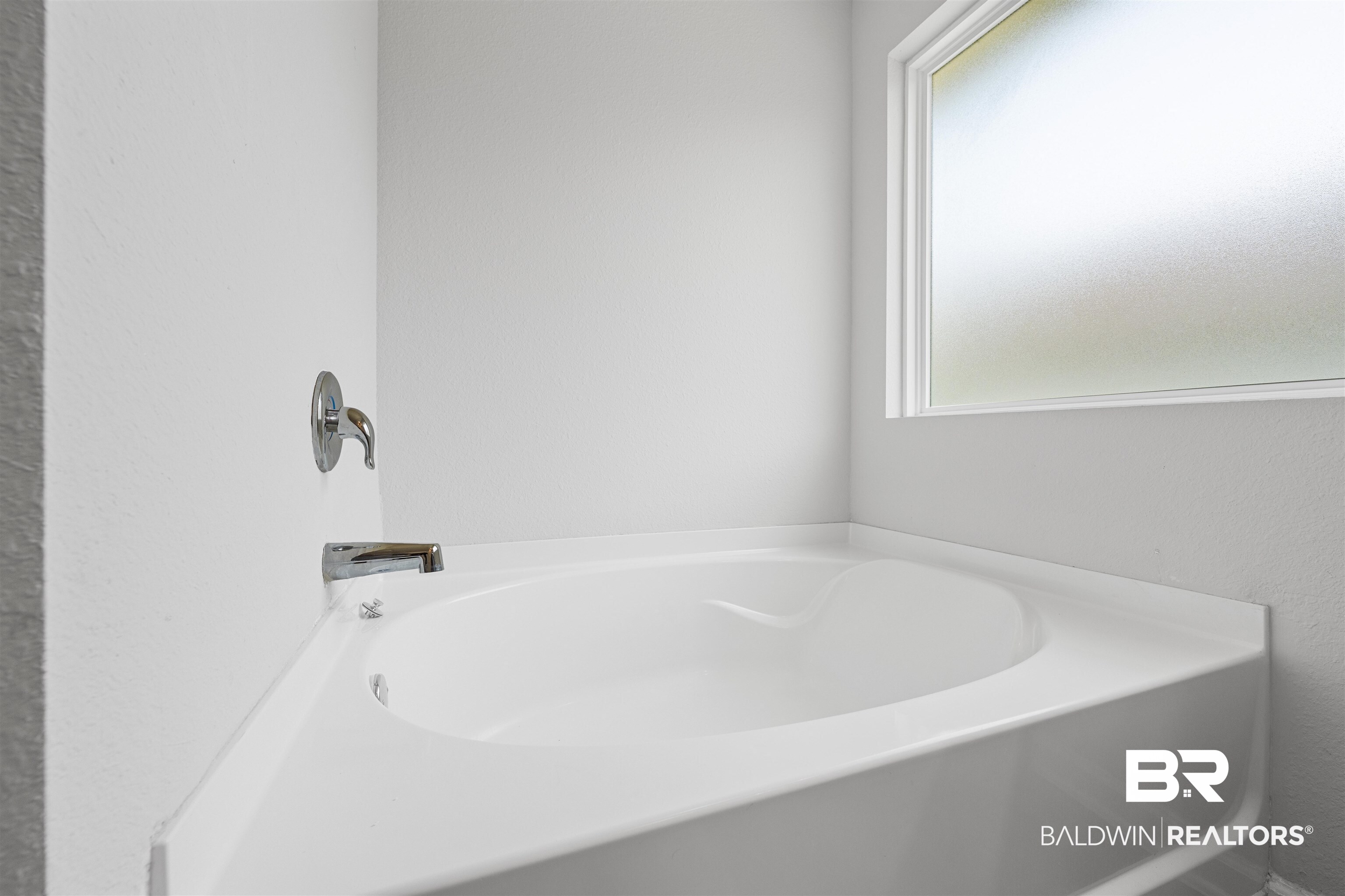 7457 Brompton Drive Foley, AL 36535 - Photo 14 of 24 Full bathroom featuring a garden tub and a textured wall