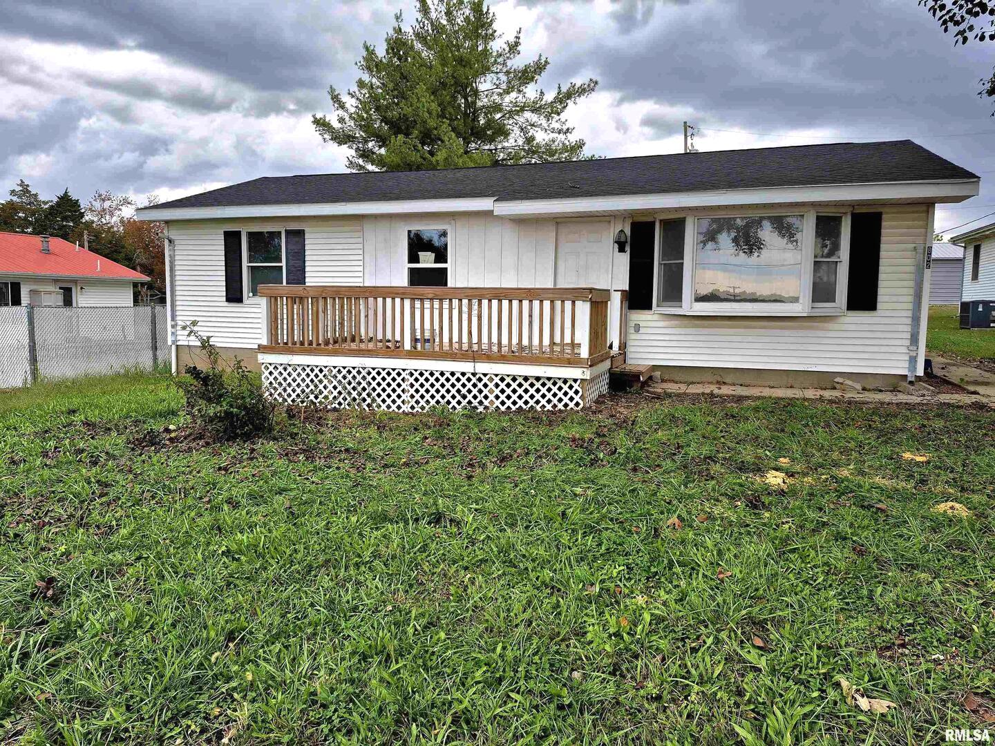 802 Dillard Street Eldorado, IL 62930 - Photo 1 of 28 a front view of a house with a garden